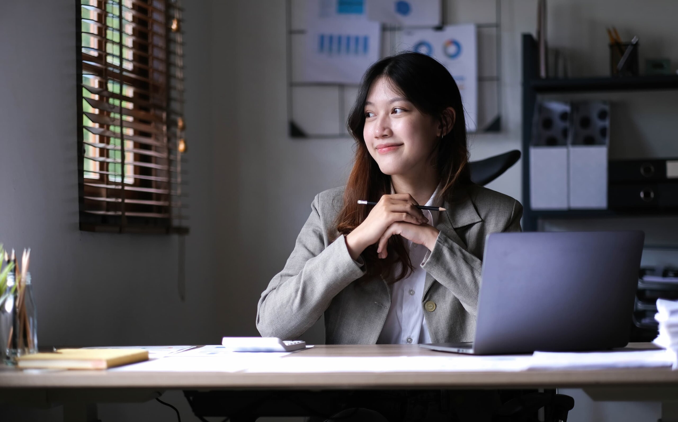 asian-business-woman-working-in-office-with-laptop